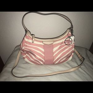 Coach pink and tan hand bag.